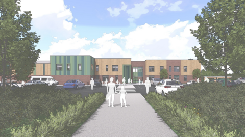A CGI image of a school with wooden and green cladding with a path leading up to the front of the school