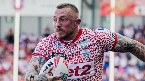 Leigh Leopards winger Josh Charnley carries the ball during a match