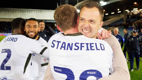 Birmingham City striker Jay Stansfield is hugged by manager Chris Davies