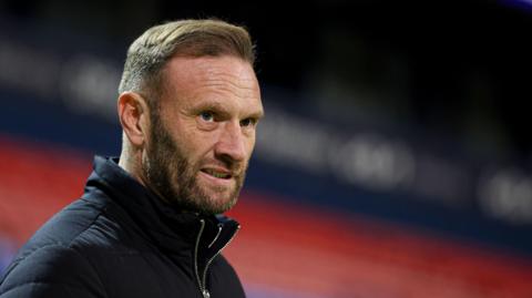 Ian Evatt looks on during Bolton Wanderers' Vertu Trophy tie against Huddersfield Town