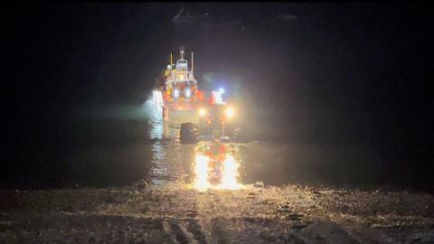 RNLI rescue lifeboat in the sea at night