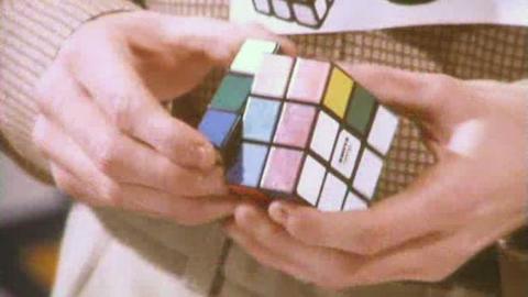 Hands holding a Rubik's cube