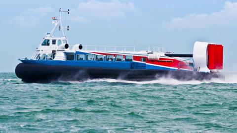Stock photo of a marine hover craft crossing the Solent at full speed.
