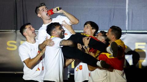 Spanish players celebrate victory at Madrid parade