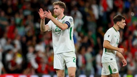 Republic of Ireland captain Nathan Collins claps to supporters after their 1-0 defeat by Portugal in Lisbon