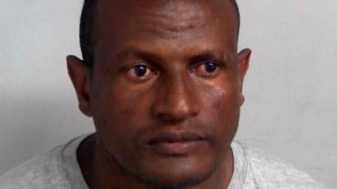 Custody shot of Hadush Kebatu