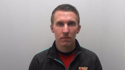 Mugshot of Jamie Wheeler who is wearing a sports jacket