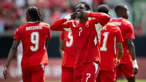 Breel Embolo celebrates with Switzerland team-mates after scoring