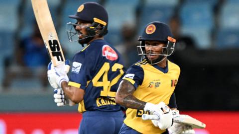 Sri Lanka's Kamil Mishara (L) and Pathum Nissanka run between the wickets