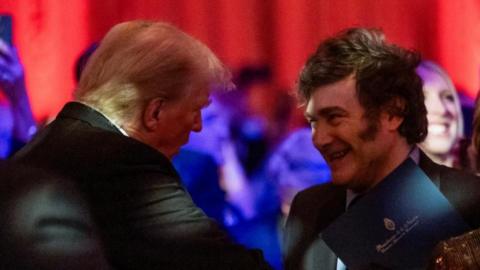 US President-elect Donald Trump shakes hands with Argentine President Javier Milei at the America First Policy Institute (AFPI) gala at Mar-A-Lago in Palm Beach, Florida, on November 14, 2024