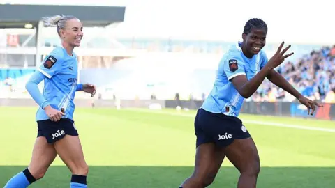Khadija Shaw celebrates