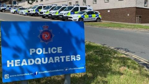 Police cars parked outside Isle of Man Constabulary HQ in Douglas