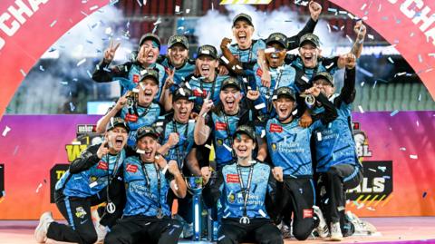 Adelaide Strikers celebrating with trophy 