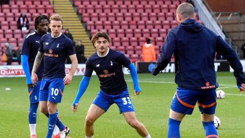 Oldham players warm up at Leyton Orient