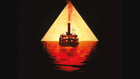 A promotional image of the Agatha Christie mystery, Death on the Nile. The picture has a triangle in the middle which has a ship inside. The top half of the triangle is an off-white colour, and the bottom half is red and black. 