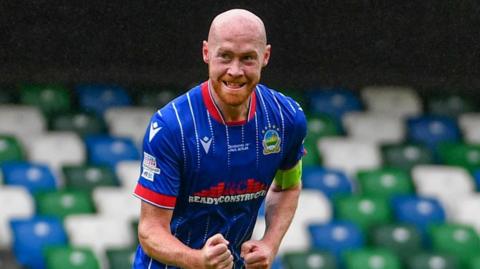 Chris Shields celebrates scoring Linfield's third goal against Dungannon