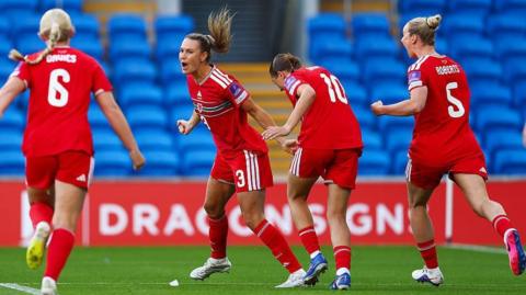 Wales' Gemma Evans (second left) celebrates her goal