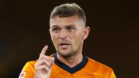 Kieran Trippier, while in action for Wolverhampton Wanderers, with his right index finger raised