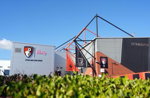 View of the top of the Cherries stadium behind a green hedge