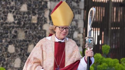 Sarah Mullally carries a crosier at Canterbury Cathedral before delivering her first Easter sermon as archbishop at Canterbury Cathedral