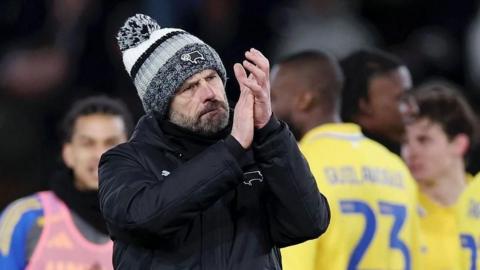 Derby County head coach Paul Warne claps the crowd