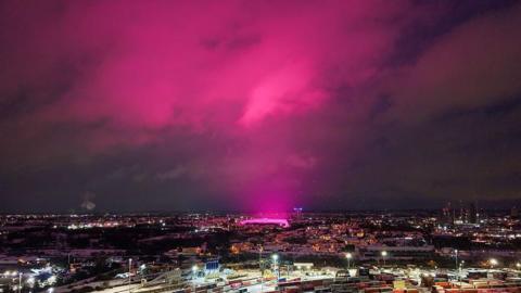 bright pink sky over Birmingham emanating from Birmingham Football Club's stadium