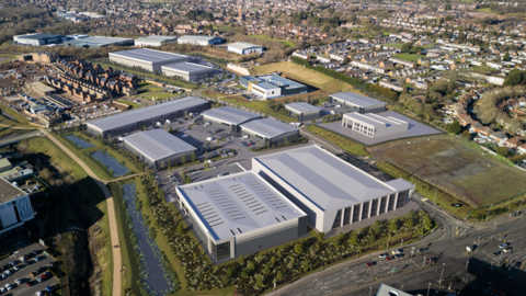 A computer-generated aerial image showing a number of silver-coloured industrial buildings on land surrounded by housing estates.