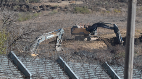 Excavators dig trenches near Majdal Shams, in the Israeli-occupied Golan Heights