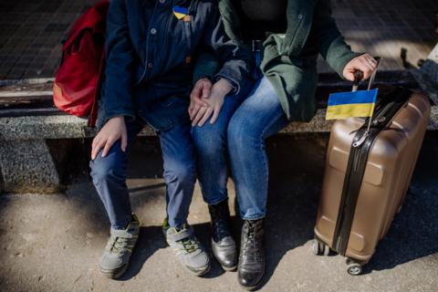 Ukrainian refugees with bags