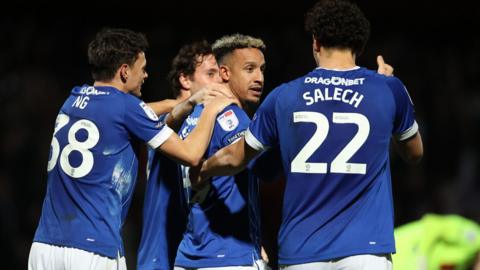 Callum Robinson celebrates with team-mates 
