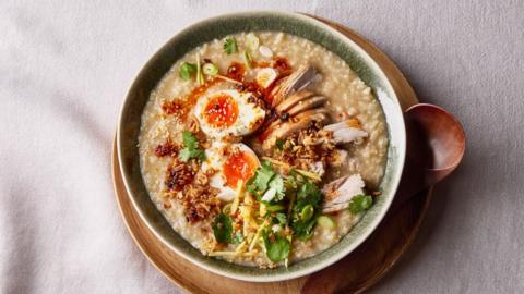 Spicy chicken congee topped with boiled eggs