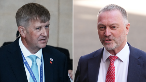 A composite photo of two people. On the left, is Peter Harris, speaking in a council chamber. He wears a dark suit, a turquoise blue tie. Steve Reed is wearing a navy blue suit and red patterned tie. He is walking right to left. He is on the right, looking into the centre of the frame.