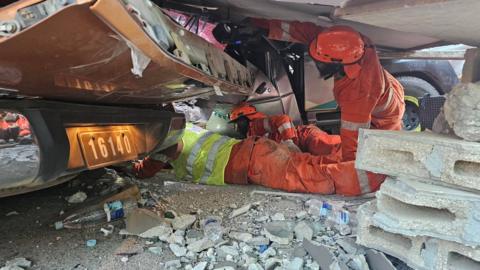 A handout photo made available by the Vanuatu Police Force shows rescue teams conducting search and rescue operations following an earthquake in Port Vil