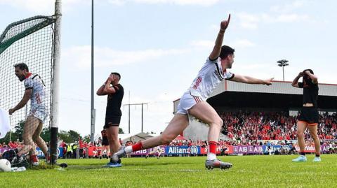 Conall McCaul celebrates as Sam Mulroy's shot ends up in the net