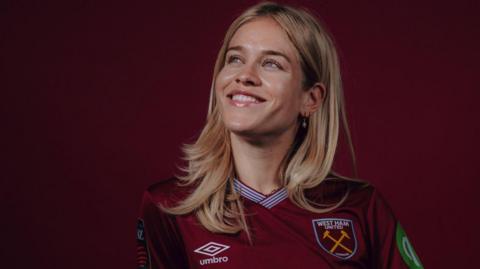 Nadine Riesen wearing a West Ham shirt