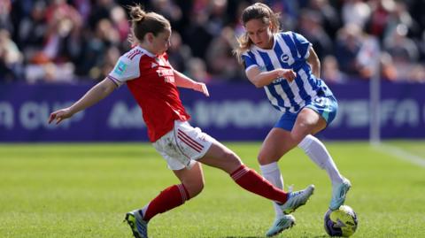 Arsenal's Kim Little challenges Brighton's Marisa Olislagers