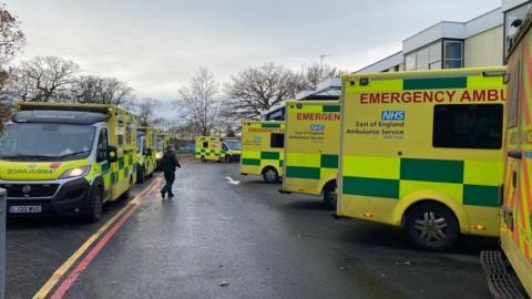 Ambulances queuing outside the Queen Elizabeth Hospital in King's Lynn in December 2023. 