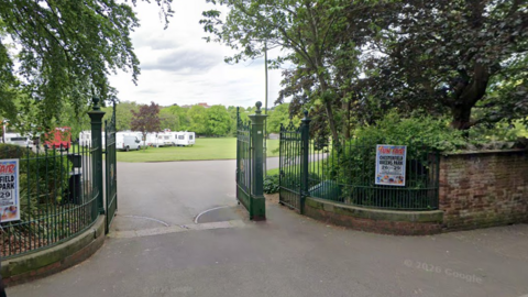 The entrance to a park from the street