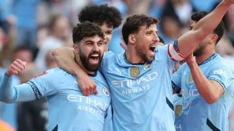 Manchester City celebrateg