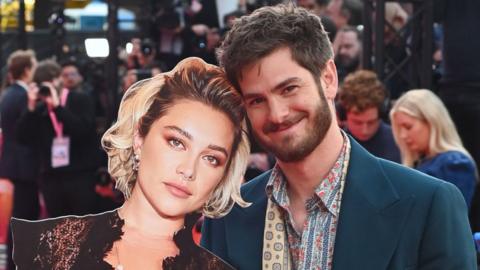 Andrew Garfield (R) poses with a cardboard cutout of Florence Pugh at the Headline Gala screening of "We Live In Time" during the 68th BFI London Film Festival at The Royal Festival Hall on October 16, 2024 in London, England