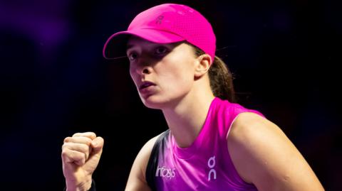 Iga Swiatek celebrates a break against Barbora Krejcikova at the WTA Finals