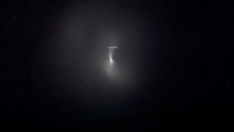 A picture of the dark black sky with the shining object.