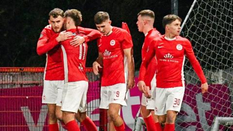 Larne players celebrate