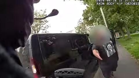 A van driver pulled over to help an armed officer catch a suspect