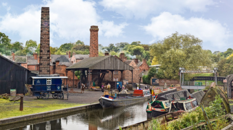 The image shows a historic canal-side industrial scene, likely part of an open‑air heritage site. The setting appears to recreate or preserve a 19th‑ or early 20th‑century working environment, with brick buildings and traditional transport.