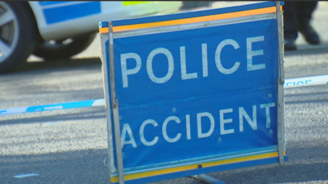 Blue sign reading 'Police Accident'