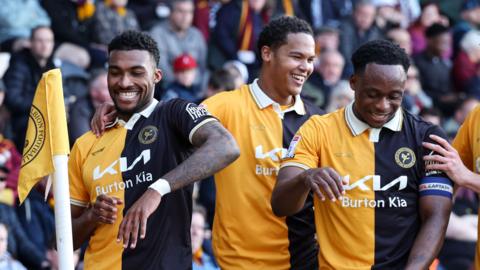 Burton celebrate a goal