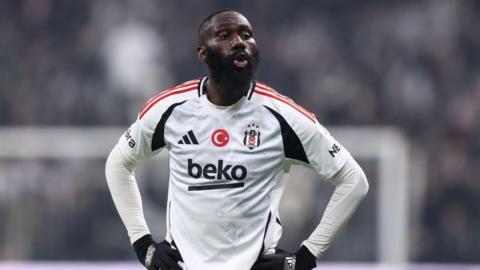 Arthur Masuaku stood with his hands on his hips while playing for Besiktas 