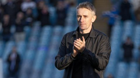 Ipswich manager Kieran McKenna applauds the Town fans at Hillsborough.