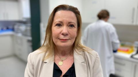 Professor Vanessa Raymont standing in a lab